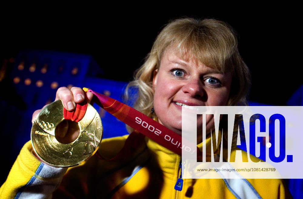 2006 Winter Olympics, Medal Ceremony, Curling: Anette Norberg of Sweden, the skip, holds up her gold medal in Turin, Italy