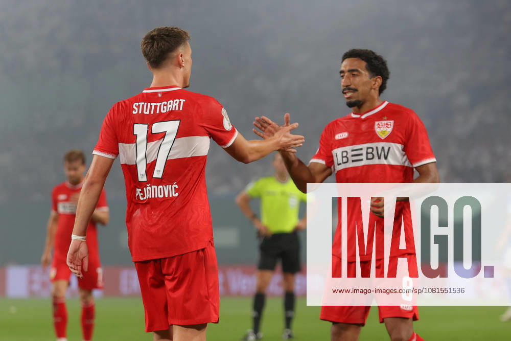 Soccer DFB Cup 1st Round, FC Hansa Rostock vs. VfB Stuttgart, from left: Dzenan Pejcinovic (Stuttgart), 17 Tiago Tomas (Stuttgart), 8 cheering, Goal celebration, celebrating the goal, Rostock