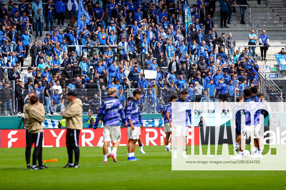 Hoffenheim fans who traveled with the team watch their squad warm up, FC Erzgebirge Aue vs. TSG Hoffenheim, soccer, DFB Cup, 1st round, 2026–2027 season, August 22, 2026, DFL regulations prohibit any use of photographs as image sequences and or quasi-video, FC Erzgebirge Aue vs. TSG Hoffenheim, soccer, DFB Cup, Round 1, 2026–2027 Season, August 22, 2026, Aue