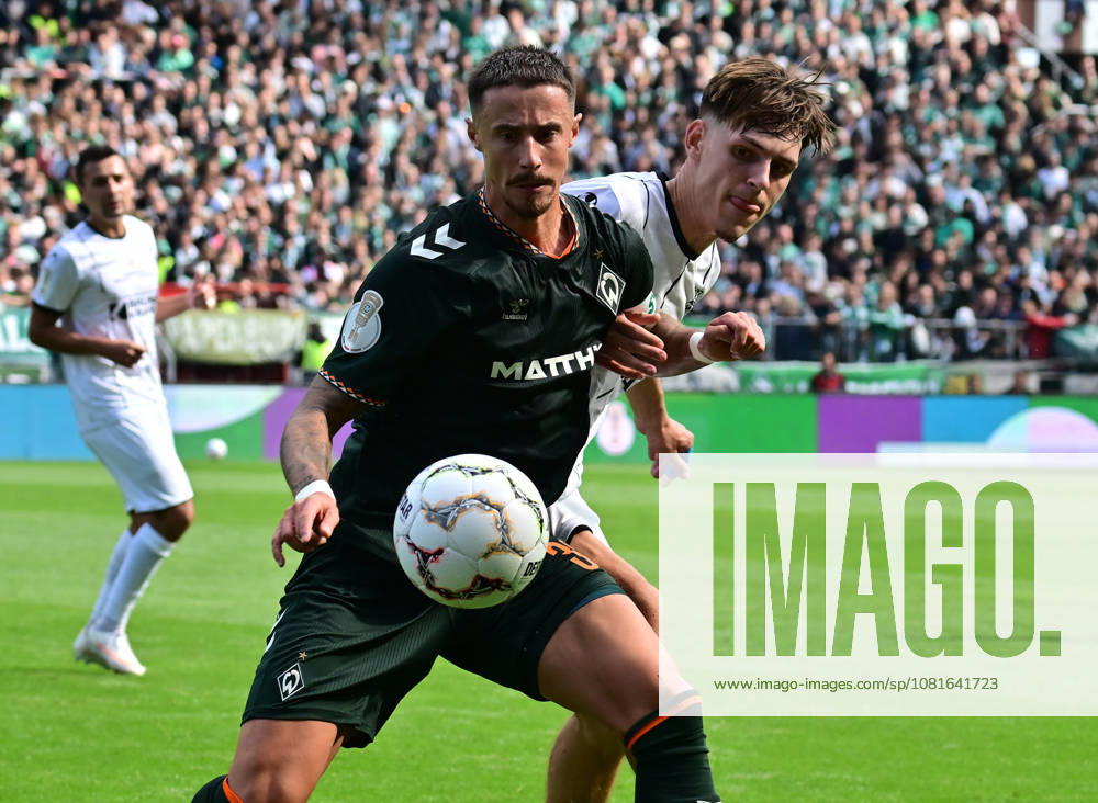 German Soccer, Men, DFB Cup, 1st Round, 2026–2027 Season, Hamburg, Lüneburger SK vs. Werder Bremen: Marco Friedl (Werder, 32) tries to get past Tjark Dörr (Lüneburg, 20). DFB and DFL regulations prohibit any use of photographs as image sequences and or quasi-video. Hamburg Millerntorstadion, Hamburg, Germany