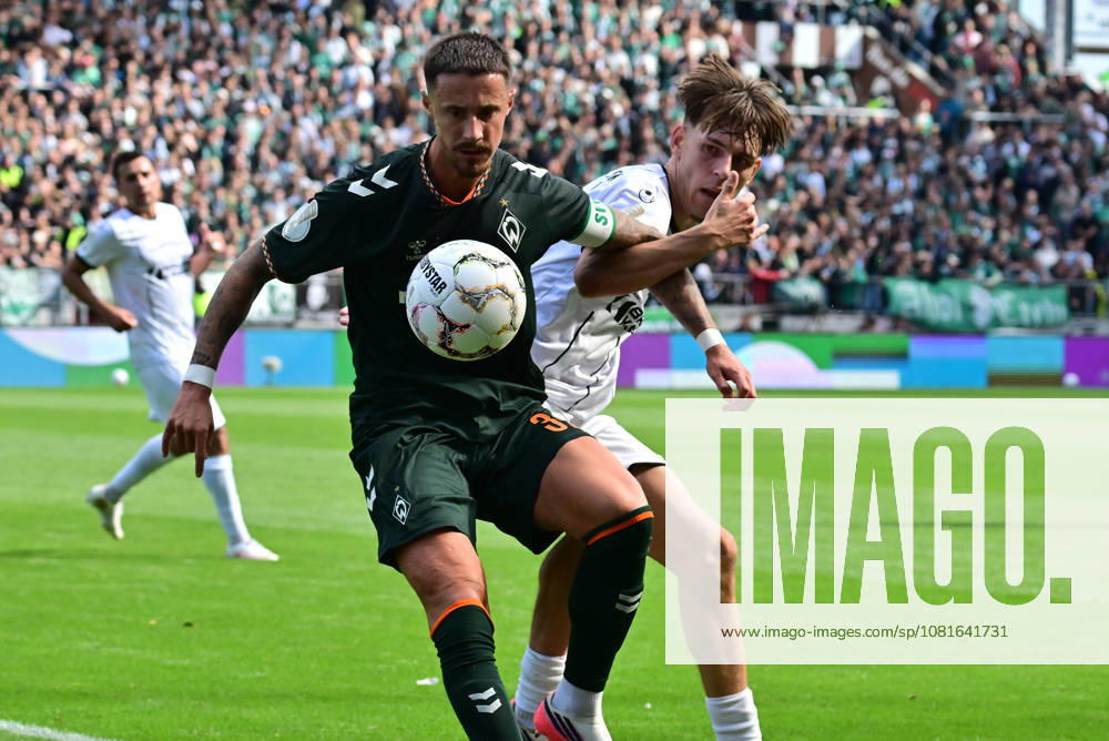 German Soccer, Men, DFB Cup, 1st Round, 2026–2027 Season, Hamburg, Lüneburger SK vs. Werder Bremen: Marco Friedl (Werder, 32) tries to get past Tjark Dörr (Lüneburg, 20). DFB and DFL regulations prohibit any use of photographs as image sequences and or quasi-video. Hamburg Millerntorstadion, Hamburg, Germany