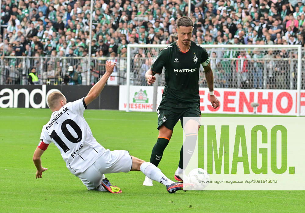German Soccer, Men s, DFB Cup, 1st Round, 2026–2027 Season, Hamburg, Lüneburger SK vs. Werder Bremen: Marco Friedl (Werder, No. 32) tries to get past Marian Kunze (Lüneburg, No. 10). DFB and DFL regulations prohibit any use of photographs as image sequences and or quasi-video. Hamburg Millerntorstadion, Hamburg, Germany