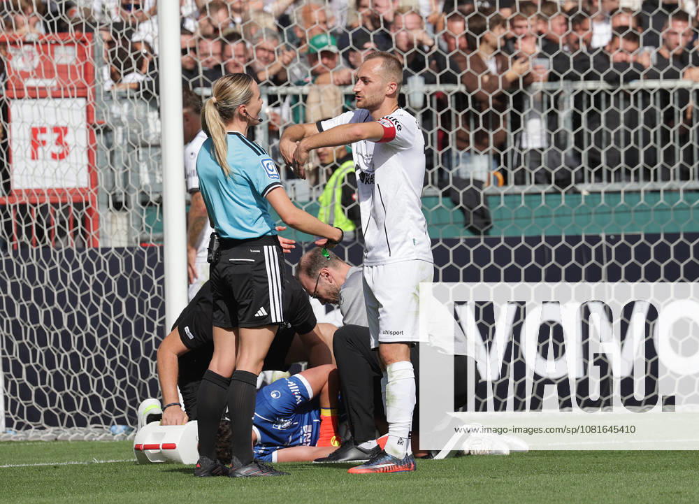 Referee Fabienne Michel, Marian Kunze, Lüneburger SK Hansa Soccer, 2026–2027 season, Men’s, DFB Cup, 1st Round, Millerntor Stadium, Lüneburger SK vs. Werder Bremen DFL REGULATIONS PROHIBIT ANY USE OF PHOTOGRAPHS AS IMAGE SEQUENCES AND OR QUASI-VIDEO