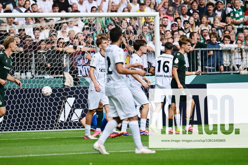 German Soccer, Men, DFB Cup, First Round, 2026–2027 Season, Hamburg, Lüneburger SK vs. Werder Bremen: Jens Stage (Werder 06) scores the 1–0 goal for Bremen, beating goalkeeper Tommy Henze (Pauli 01). DFB and DFL regulations prohibit any use of photographs as image sequences and or quasi-video. Hamburg Millerntorstadion, Hamburg, Germany