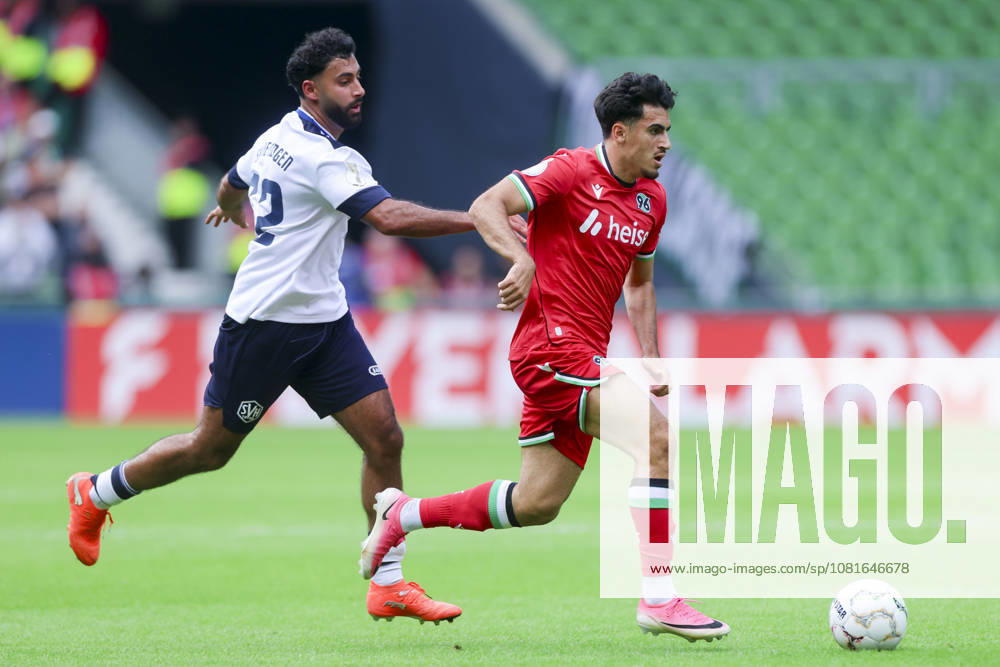 Berkay Isik of SV Hemelingen and Husseyn Chakroun of Hannover 96 battle for the ball during the DFB Cup match between SV Hemelingen and Hannover 96 at Weserstadion on August 22, 2026, in Bremen, Germany Photo by Marco Steinbrenner, DeFodi Images Berkay Isik of SV Hemelingen and Husseyn Chakroun of Hannover 96 battle for the ball during the DFB Cup match between SV Hemelingen and Hannover 96 at Weserstadion on August 22, 2026 in Bremen, Germany. Photo by Marco Steinbrenner, DeFodi Images. Photo by Marco Steinbrenner, DeFodi Images.