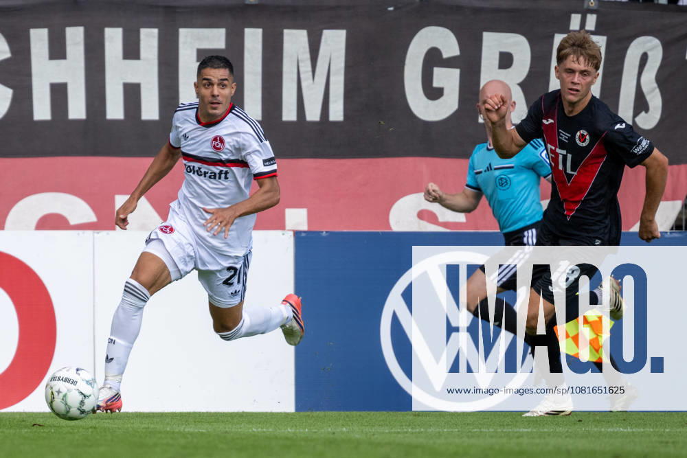 Tackle between Ioannis Masouras of 1. FC Nuremberg, 21, and Tim Kloss of Viktoria Cologne, 18—Viktoria Cologne vs. 1. FC Nuremberg, Soccer, DFB Cup, First Round, 2026–2027 Season, August 22, 2026. DFL and DFB regulations prohibit any use of photographs as image sequences and or quasi-video. Viktoria Cologne vs. 1. FC Nuremberg, soccer, DFB Cup, 1st round, 2026–2027 season, August 22, 2026, Cologne