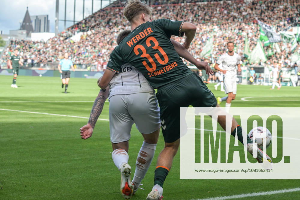 Mick Schmetgen of SV Werder Bremen, age 33, in a tackle; Lüneburger SK vs. Hansa SV Werder Bremen; soccer; DFB Cup; DFB; August 22, 2026. DFB regulations prohibit any use of photographs as image sequences and or quasi-video. Hamburg, Hamburg, Germany