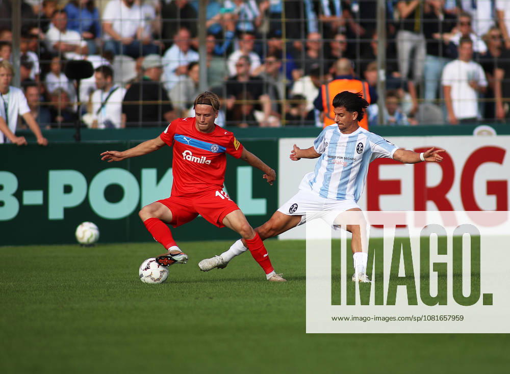 Soccer, Men s, DFB Cup, First Round, 2026–2027 Season, TSV 1860 Munich vs. Holstein Kiel, Grünwalder Stadium: Jonas Therkelsen of Holstein Kiel (left) and Tunay Deniz of TSV 1860 Munich (right) battle for the ball