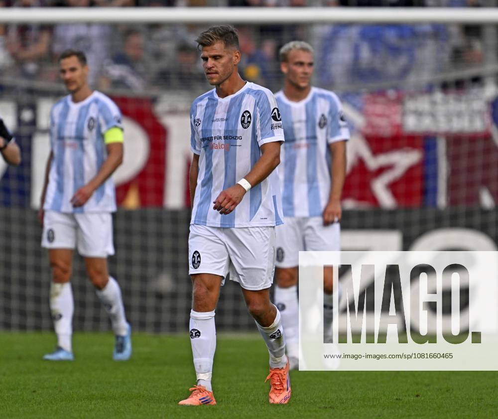 Soccer DFB Cup 2026–27, First Round, TSV 1860 Munich vs. Holstein Kiel, at the Grünwalderstrasse Stadium in Munich; from left: Dennis Dressel (TSV 1860 Munich), Florian Niederlechner of TSV 1860 Munich and Lasse Faßmann of TSV 1860 Munich hang their heads in disappointment after the 0–1 loss
