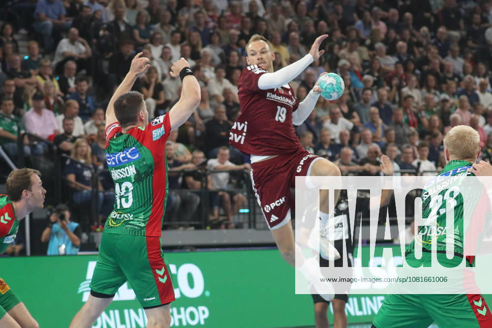 Handball, 2026 Rexel Supercup, SC Magdeburg vs. Füchse Berlin, from left: Mathias Gidsel (Berlin), 19, scores a goal, goal scorer, scores the goal, Munich