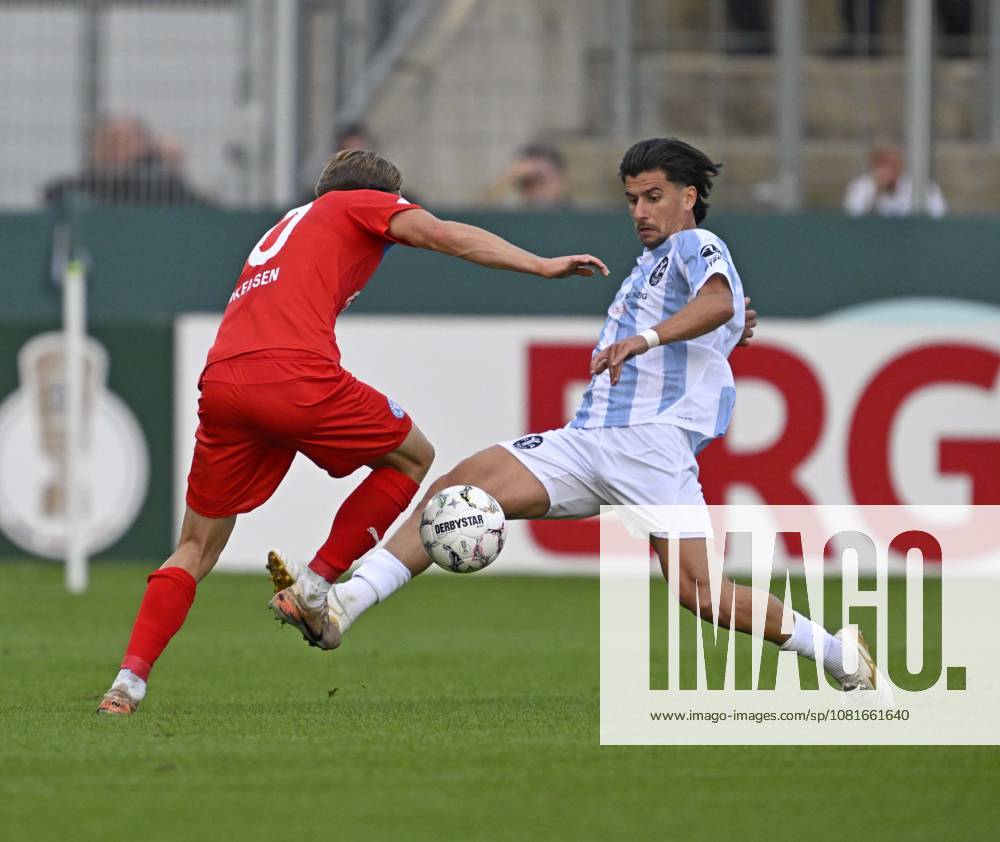 2026–27 DFB Cup, First Round, TSV 1860 Munich vs. Holstein Kiel, at the Stadion an der Grünwalderstrasse in Munich; from left: Jonas Therkelsen (Holstein Kiel) vs. Tunay Deniz (TSV 1860 Munich)