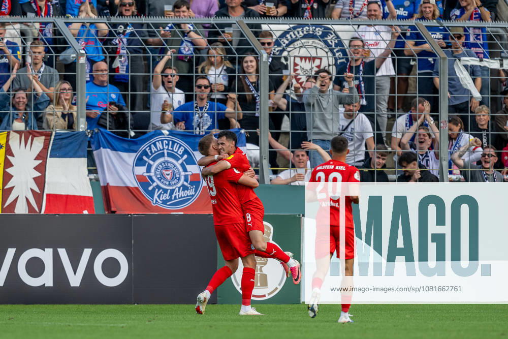 Guillermo Balzi, Holstein Kiel, 08, celebrates with Phil Harres, Holstein Kiel, 19, after his goal to make it 0-1 GER, TSV 1860 Munich vs. Holstein Kiel, Soccer, DFB Cup, Round 1, 2026–2027 season, August 22, 2026 DFL and DFB regulations prohibit any use of photographs as image sequences and or quasi-video. Photo: HMB Media, Heike Feiner