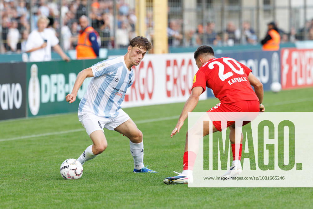 Emre Erdogan, 19, TSV 1860 Munich, and Adrian Kapralik, 20, Holstein Kiel, during the match between TSV 1860 Munich and Holstein Kiel, soccer, men s, DFB Cup, 2026–2027, First Round on August 22, 2026, in Munich, Städtisches Stadion an der Grünwalder Straße, Bavaria, Germany