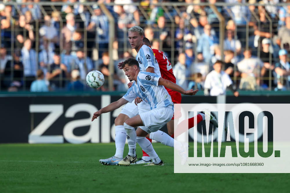 Benedikt Hoppe, TSV 1860 Munich, 06, with Lasse Fassmann, TSV 1860 Munich, 33, GER, TSV 1860 Munich vs. Holstein Kiel, Soccer, DFB Cup, 1st Round, 2026–2027 Season, August 22, 2026, DFL regulations prohibit any use of photographs as image sequences, GER, TSV 1860 Munich vs. Holstein Kiel, Soccer, DFB Cup, Round 1, 2026–2027 Season, August 22, 2026, Munich
