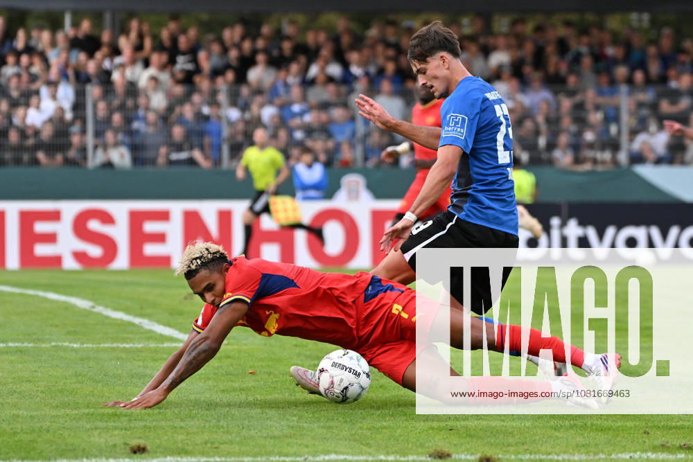 Soccer, DFB Cup, First Round, Eintracht Trier vs. RB Leipzig: Antonio Nusa (RB Leipzig) vs. Frederik Rahn (SV Eintracht Trier 05), tackle, action, battle for the ball, Trier