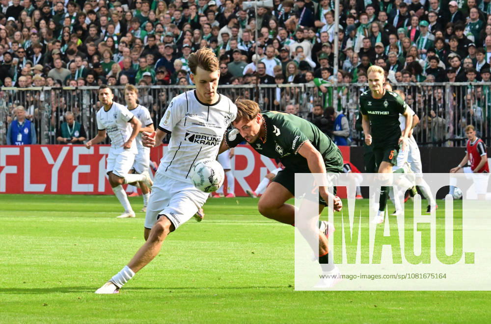German Soccer, Men s, DFB Cup, 1st Round, 2026–2027 Season, Hamburg, Lüneburger SK vs. Werder Bremen: Tjark Dörr (Lüneburg 20) tries to get past Olivier Deman (Werder 02). DFB and DFL regulations prohibit any use of photographs as image sequences and or quasi-video. Hamburg Millerntorstadion, Hamburg, Germany