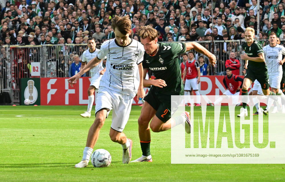 German Soccer, Men s, DFB Cup, 1st Round, 2026–2027 Season, Hamburg, Lüneburger SK vs. Werder Bremen: Tjark Dörr (Lüneburg 20) tries to get past Olivier Deman (Werder 02). DFB and DFL regulations prohibit any use of photographs as image sequences and or quasi-video. Hamburg Millerntorstadion, Hamburg, Germany