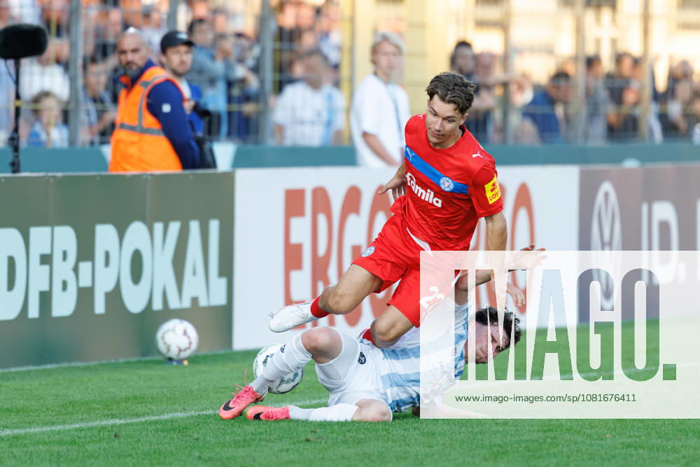 Moritz Reimers, 22, Holstein Kiel, and Lance Fiedler, 47, TSV 1860 Munich, during the match between TSV 1860 Munich and Holstein Kiel, soccer, men s, DFB Cup, 2026–2027, Round 1 on August 22, 2026, in Munich, Städtisches Stadion an der Grünwalder Straße, Bavaria, Germany