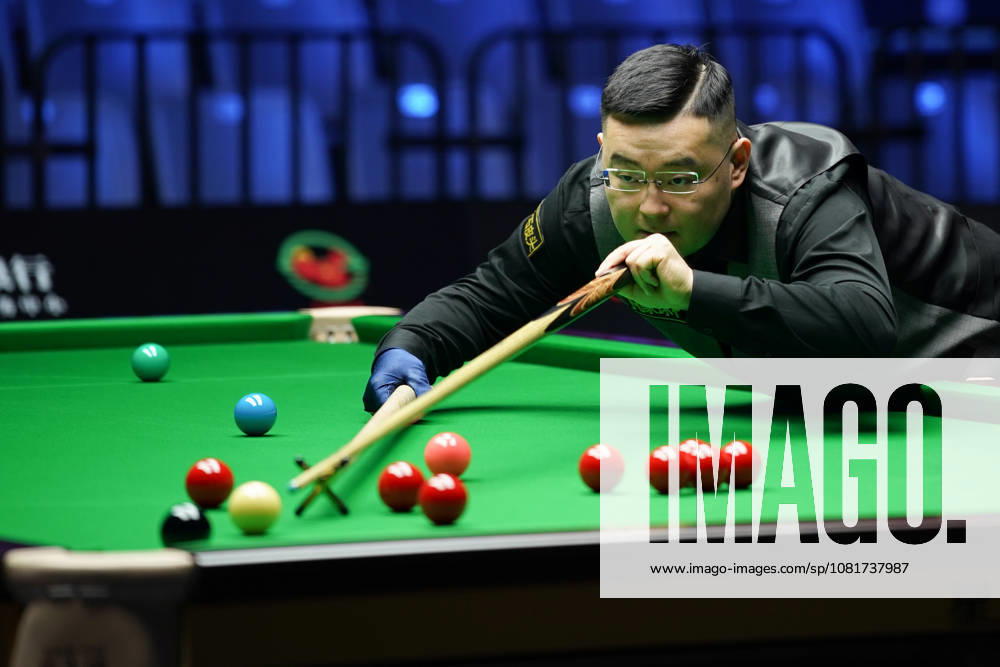 Guan Zhen of China plays a shot in the first round match against Gao Yang of China on day 1 of Wuhan Open 2026 at the Optics Valley Gymnasium of Huazhong University of Science and Technology on August 23, 2026 in Wuhan, Hubei Province of China.