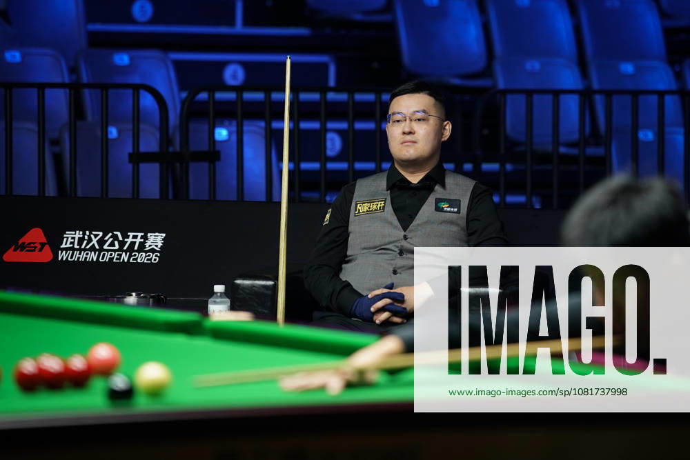 Guan Zhen of China reacts in the first round match against Gao Yang of China on day 1 of Wuhan Open 2026 at the Optics Valley Gymnasium of Huazhong University of Science and Technology on August 23, 2026 in Wuhan, Hubei Province of China.