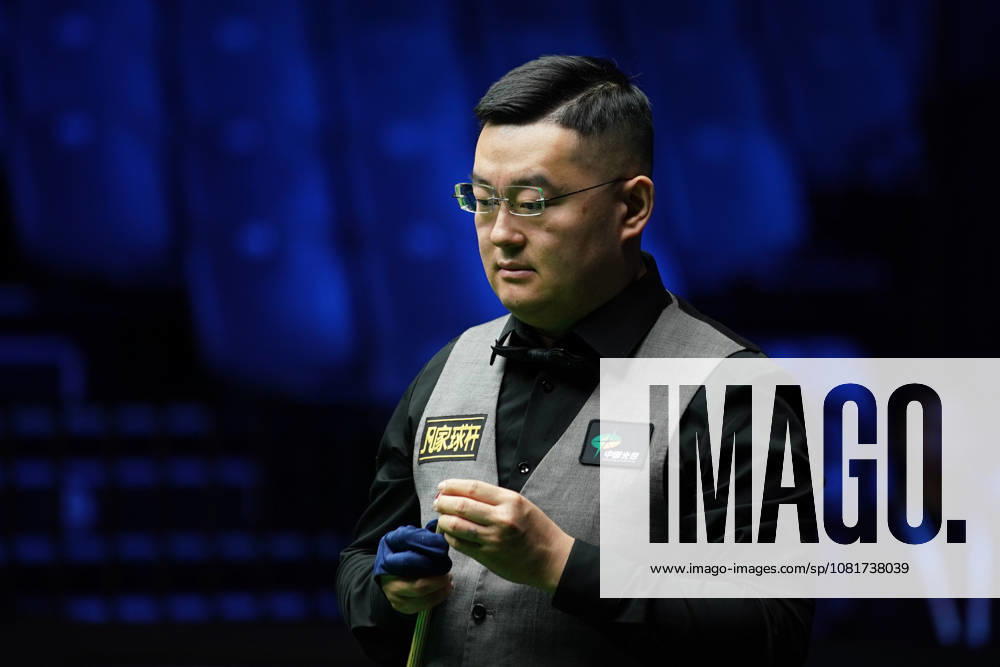 Guan Zhen of China chalks the cue in the first round match against Gao Yang of China on day 1 of Wuhan Open 2026 at the Optics Valley Gymnasium of Huazhong University of Science and Technology on August 23, 2026 in Wuhan, Hubei Province of China.