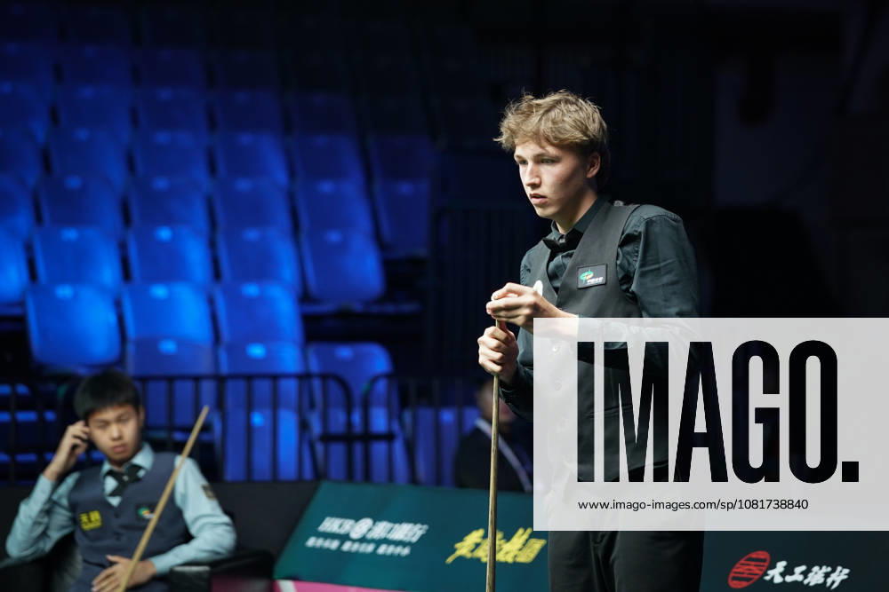 Ben Mertens of Belgium chalks the cue in the first round match against Wang Xinzhong of China on day 1 of Wuhan Open 2026 at the Optics Valley Gymnasium of Huazhong University of Science and Technology on August 23, 2026 in Wuhan, Hubei Province of China.