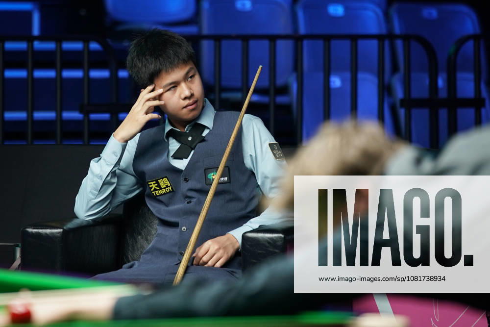 Wang Xinzhong of China reacts in the first round match against Ben Mertens of Belgium on day 1 of Wuhan Open 2026 at the Optics Valley Gymnasium of Huazhong University of Science and Technology on August 23, 2026 in Wuhan, Hubei Province of China.