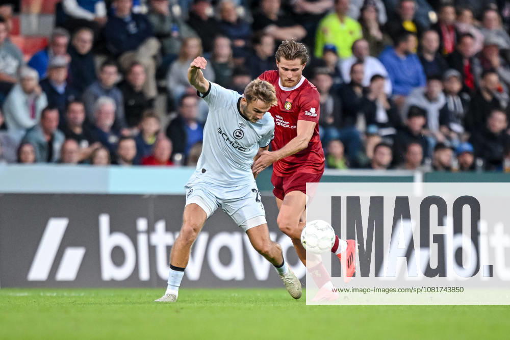 Tim Handwerker of Arminia Bielefeld and Tim Rossmann of SG Sonnenhof Grossaspach battle for the ball during the DFB Cup first-round match between SG Sonnenhof Grossaspach and Arminia Bielefeld at the Wir machen Druck Arena on August 22, 2026, in Grossaspach, Germany. Photo by Harry Langer, DeFodi Images. Tim Handwerker of Arminia Bielefeld and Tim Rossmann of SG Sonnenhof Grossaspach battle for the ball during the DFB Cup first-round match between SG Sonnenhof Grossaspach and Arminia Bielefeld at the Wir machen Druck Arena on August 22, 2026 in Grossaspach, Germany. Photo by Harry Langer, DeFodi Images. Photo by Harry Langer, DeFodi Images. DFB and DFL regulations prohibit any use of photographs as image sequences and or quasi-video.