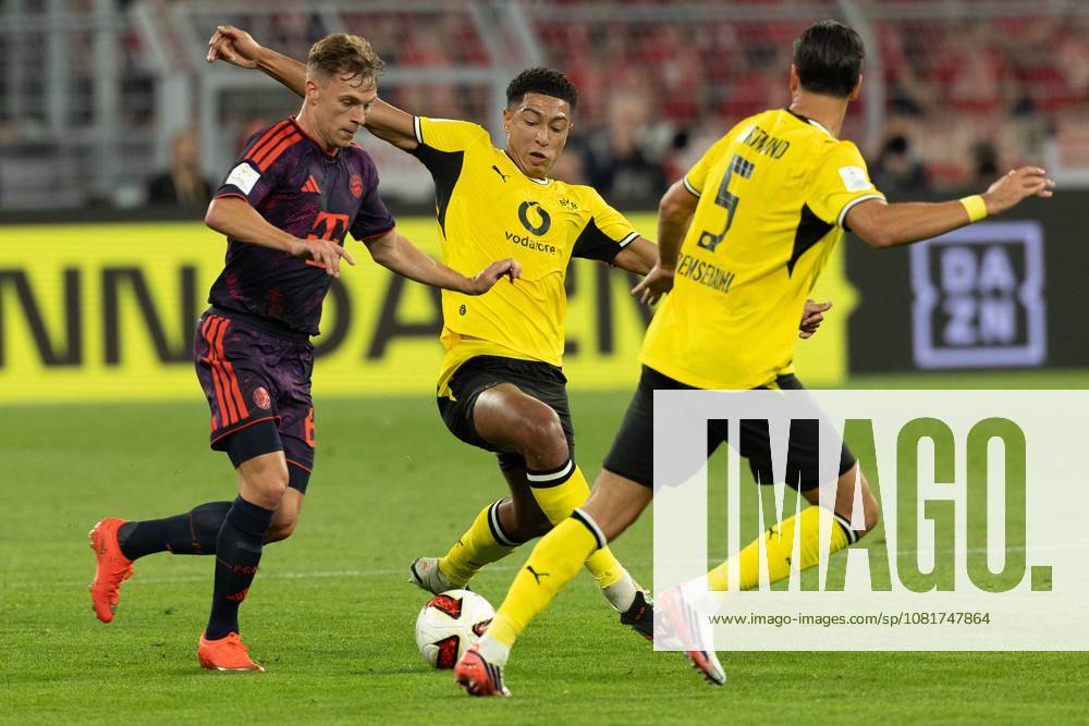 (260823) -- DORTMUND, Aug. 23, 2026 -- Jobe Bellingham (C) and Ramy Bensebaini (R) of Borussia Dortmund vie with Joshua Kimmich of FC Bayern Munich during the Franz Beckenbauer Supercup 2026 football match between FC Bayern Munich and Borussia Dortmund in Dortmund, Germany, Aug. 22, 2026. (Photo by Xinhua) (SP)GERMANY-DORTMUND-FOOTBALL-SUPERCUP-MUNICH VS DORTMUND JoachimxBywaletz