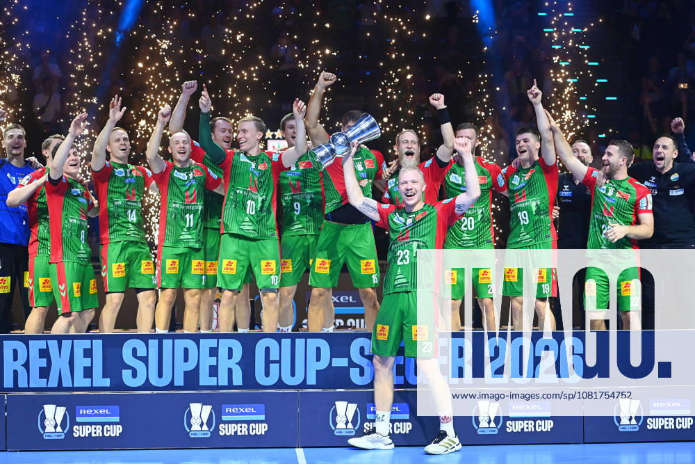 Awards Ceremony: Magnus SAUGSTRUP, SC Magdeburg, with trophy, cup, award, players, team photo, team, squad, team photo, celebration,joy, excitement, handball Rexel Super Cup 2026 (men’s) SC Magdeburg vs. Füchse Berlin 38–30 on August 22, 2026, at SAP GARDEN in Munich