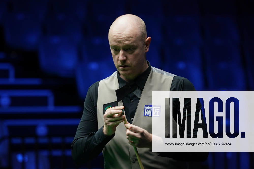 Chris Wakelin of England chalks the cue in the first round match against Jordan Brown of Northern Ireland on day 1 of Wuhan Open 2026 at the Optics Valley Gymnasium of Huazhong University of Science and Technology on August 23, 2026 in Wuhan, Hubei Province of China.