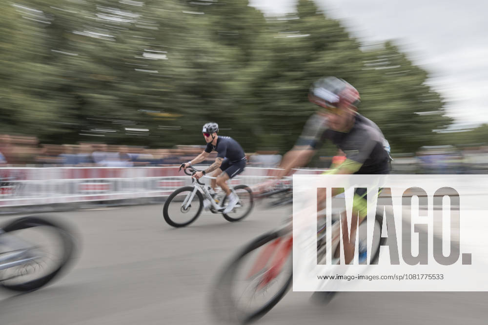 IRONMAN 70.3 Leipzig 2026 Cycling Segment, Sachsenbrücke: Athletes at the IRONMAN 70.3 Leipzig on August 23, 2026, during the cycling leg. The half-distance race consists of a 1.9-kilometer swim, a 90-kilometer bike ride, and a 21.1-kilometer run, and is part of the international IRONMAN 70.3 series