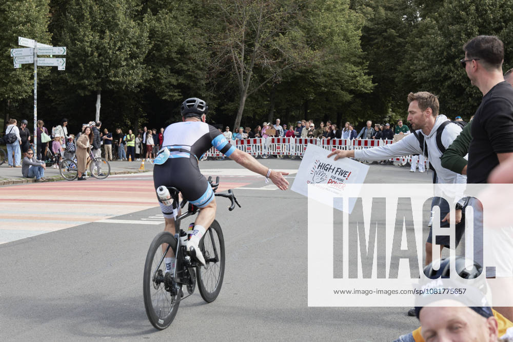 IRONMAN 70.3 Leipzig 2026 Cycling Segment, Sachsenbrücke: Athletes at the IRONMAN 70.3 Leipzig on August 23, 2026, during the cycling portion. The half-distance race consists of a 1.9-kilometer swim, a 90-kilometer bike ride, and a 21.1-kilometer run, and is part of the international IRONMAN 70.3 series