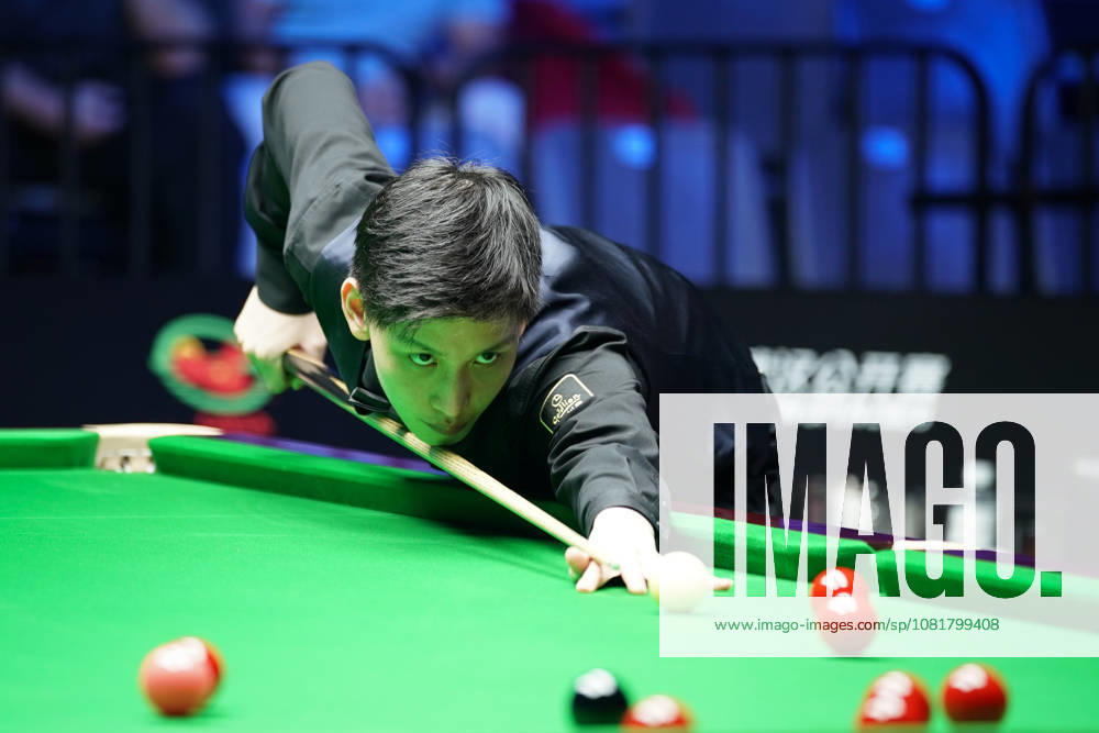 Wang Xinbo of China plays a shot during the Round of 64 match against Xiao Guodong at the Wuhan Open 2026 on August 23, 2026 in Wuhan, Hubei Province of China. Xiao Guodong defeated Wang Xinbo 5-0 to advance to the Round of 32.