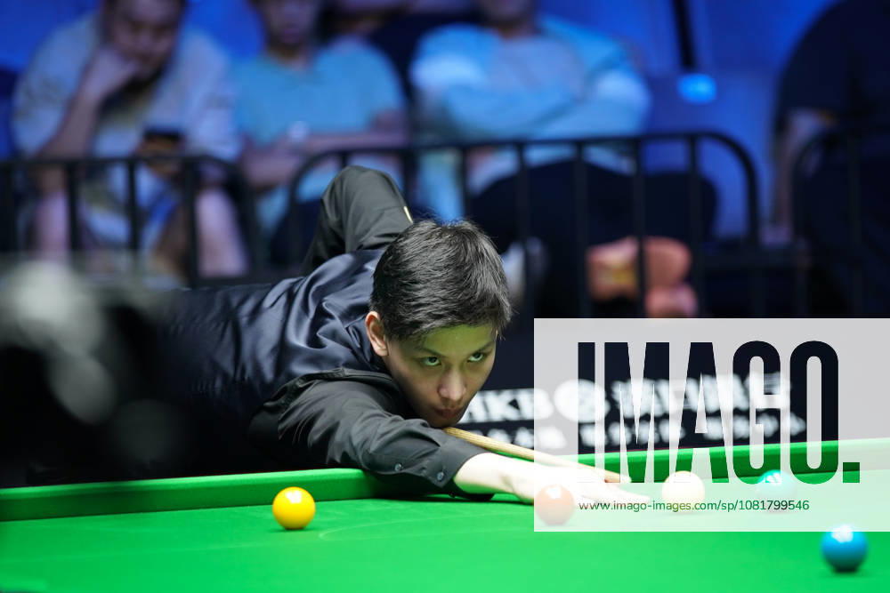Wang Xinbo of China plays a shot during his match against Xiao Guodong of China in the round of 64 at the 2026 Wuhan Open on August 23, 2026 in Wuhan, Hubei Province of China. Xiao defeated Wang 5-0 to advance to the round of 32.