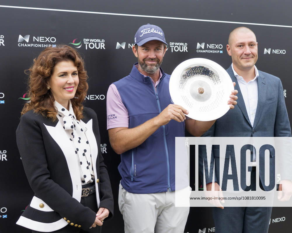 BALMEDIE, SCOTLAND - AUG 23: Scott Jamieson (SCO) receives the Nexo Trophy from Sarah Malone Head of the Trump International after Round 4 at the 2026 Nexo Championship at the Trump International Golf Links, Balmedie on August 23, 2026 in Aberdeenshire, Scotland The 2026 Nexo Championship