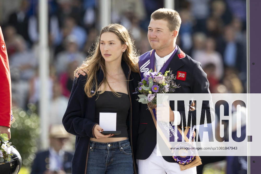 Harry CHARLES (GBR), right, with his wife Eve JOBS, left, and the owner of the horse LT Holst, Freda; joy and laughter at the award ceremony for the S3 Jumping, Round A, FEI Jumping World Championship Individual Final LONGINES Prize, on August 23, 2026, FEI World Equestrian Games Aachen 2026, August 11–23, 2026, in Aachen, Germany Â