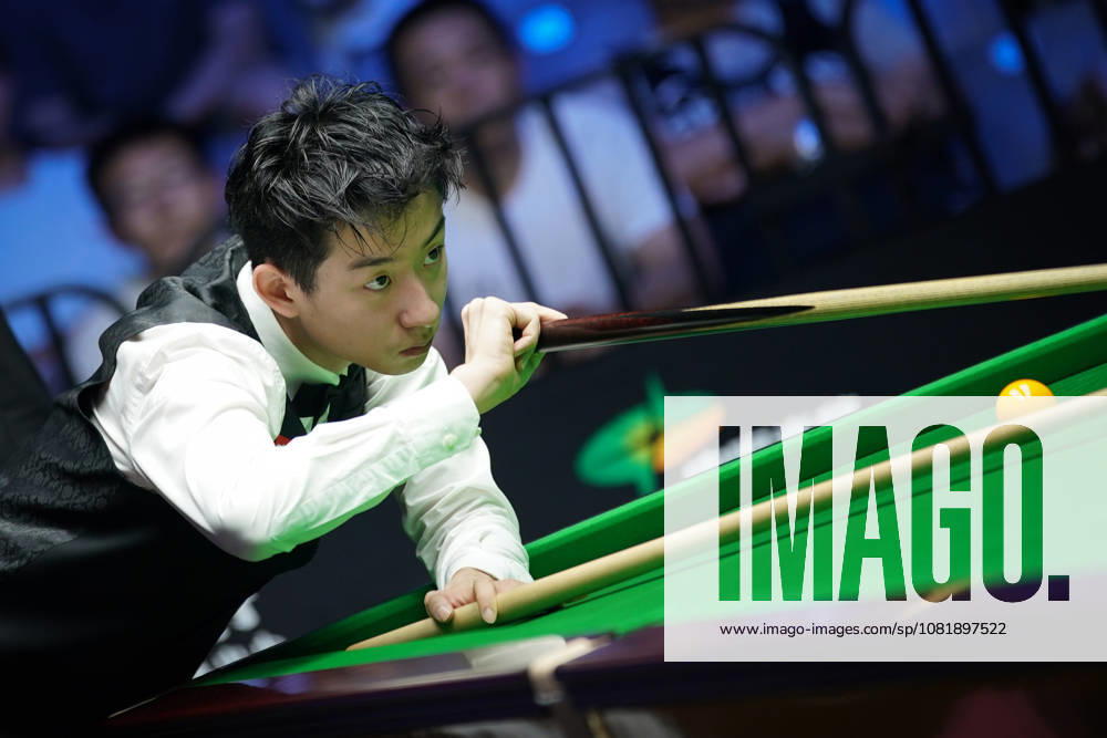 Wu Yize of China plays a shot in the second round match against Artemijs Zizins of Latvia on day 2 of Wuhan Open 2026 at the Optics Valley Gymnasium of Huazhong University of Science and Technology on August 24, 2026 in Wuhan, Hubei Province of China.