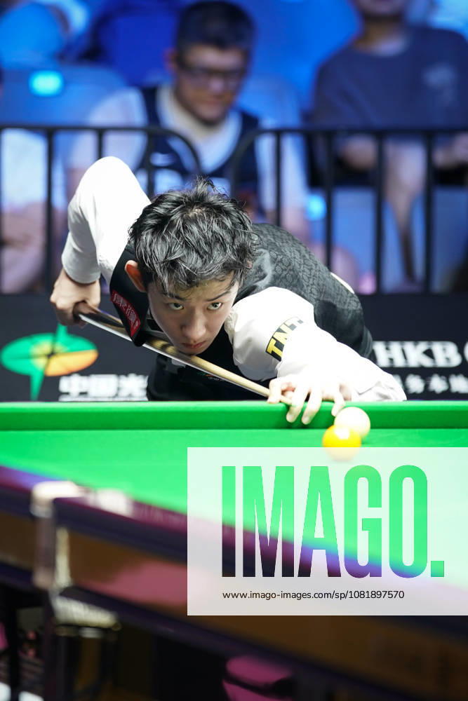 Wu Yize of China plays a shot in the second round match against Artemijs Zizins of Latvia on day 2 of Wuhan Open 2026 at the Optics Valley Gymnasium of Huazhong University of Science and Technology on August 24, 2026 in Wuhan, Hubei Province of China.