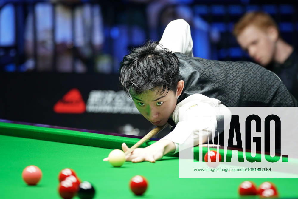 Wu Yize of China plays a shot in the second round match against Artemijs Zizins of Latvia on day 2 of Wuhan Open 2026 at the Optics Valley Gymnasium of Huazhong University of Science and Technology on August 24, 2026 in Wuhan, Hubei Province of China.