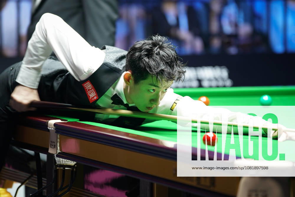 Wu Yize of China plays a shot in the second round match against Artemijs Zizins of Latvia on day 2 of Wuhan Open 2026 at the Optics Valley Gymnasium of Huazhong University of Science and Technology on August 24, 2026 in Wuhan, Hubei Province of China.