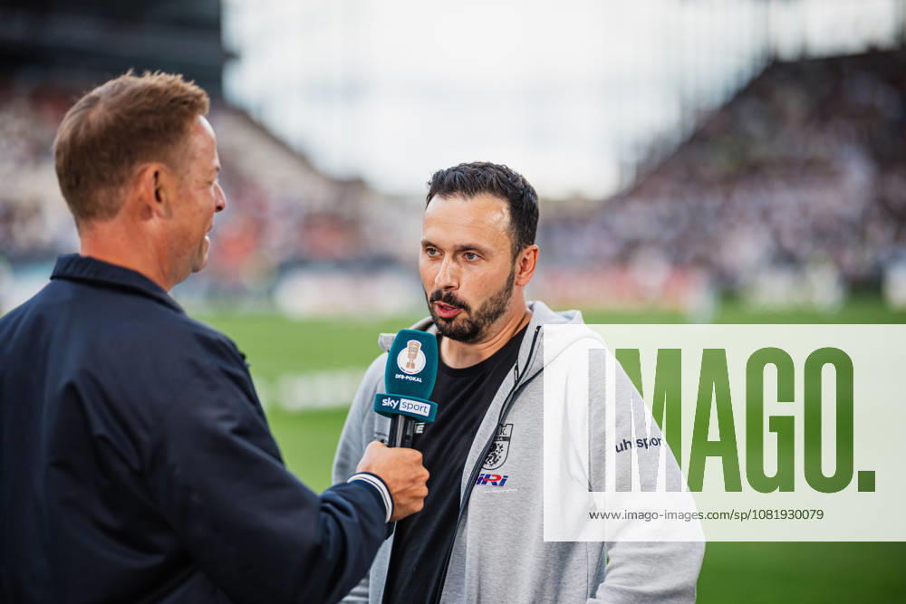DFB Cup: Lüneburger SK vs. SV Werder Bremen, August 22, 2026; Tarek Gibbah, Lüneburger SK coach, and Hansa warming up; Soccer, DFB Cup, First Round: Lüneburger SK vs. SV Werder Bremen on August 22, 2026, at Millerntor Stadium, Hamburg. DFB regulations prohibit any use of photographs as image sequences and or quasi-video.