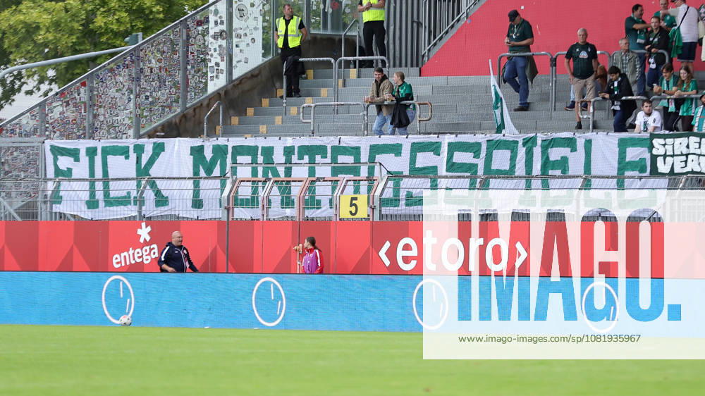 SV Werder Bremen fans display a banner in the fan section with the words Fuck Monday Games, protesting Monday games in the Women’s Bundesliga; fans, ultras, crowd, spectators, mood, atmosphere, stadium, DFB GUIDELINES PROHIBIT ANY USE OF PHOTOS AS SEQUENCE IMAGES AND OR VIDEO-LIKE PHOTO SERIES DFB REGULATIONS PROHIBIT ANY USE OF PHOTOGRAPHS AS IMAGE SEQU, August 24, 2026, Mainz, Germany, soccer, Google Pixel Women’s Bundesliga, 1. FSV Mainz 05 vs. SV Werder Bremen