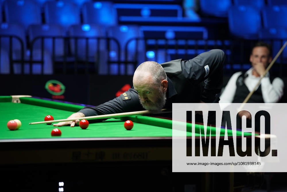 Mark Williams of Wales plays a shot during his Round of 32 match against David Gilbert of England at the 2026 Wuhan Snooker Open on August 24, 2026 in Wuhan, Hubei Province of China. The tournament features top snooker players competing for the championship title.
