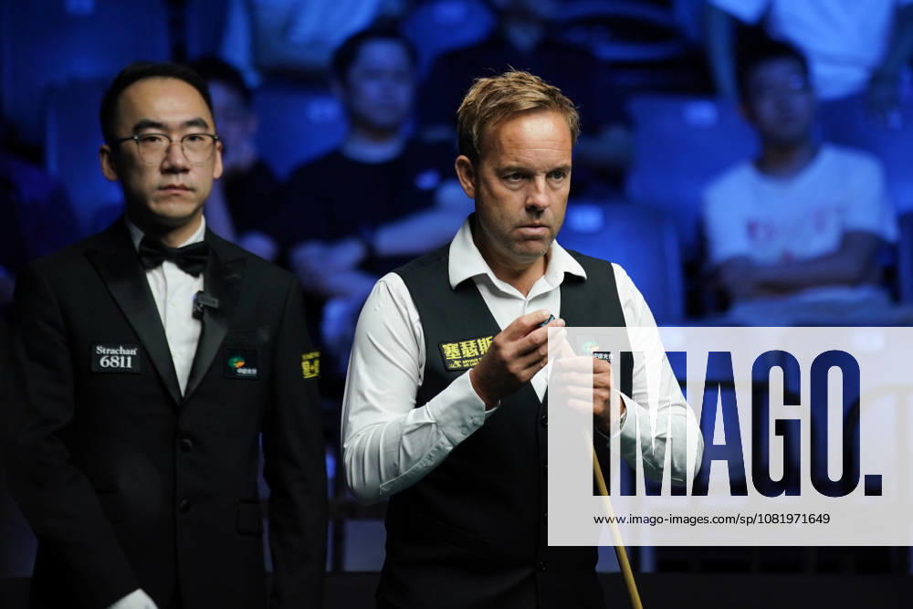 Ali Carter of England chalks the cue in the third round match against Kyren Wilson of England on day 3 of Wuhan Open 2026 at the Optics Valley Gymnasium of Huazhong University of Science and Technology on August 25, 2026 in Wuhan, Hubei Province of China.