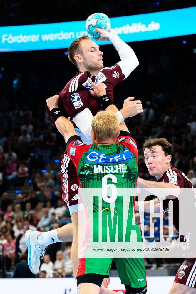 Munich HBL Super Cup 2026: SC Magdeburg vs. Füchse Berlin; Mathias Gidsel (Berlin) and Matthias Musche (SC Magdeburg) in a one-on-one matchup; Munich SAP Garden, Bavaria, Germany