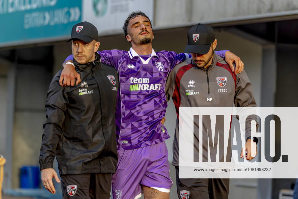 Burghausen, Germany, August 25, 2026, Toto Cup, 2026–2027 Bavarian State Cup, Round of 16: SV Wacker Burghausen vs. FC Ingolstadt 04. Pictured, second from left: Davide Danilo Sekulovic of FCI is escorted off the field after sustaining an injury at the flatbuy Stadium in Bavaria.
