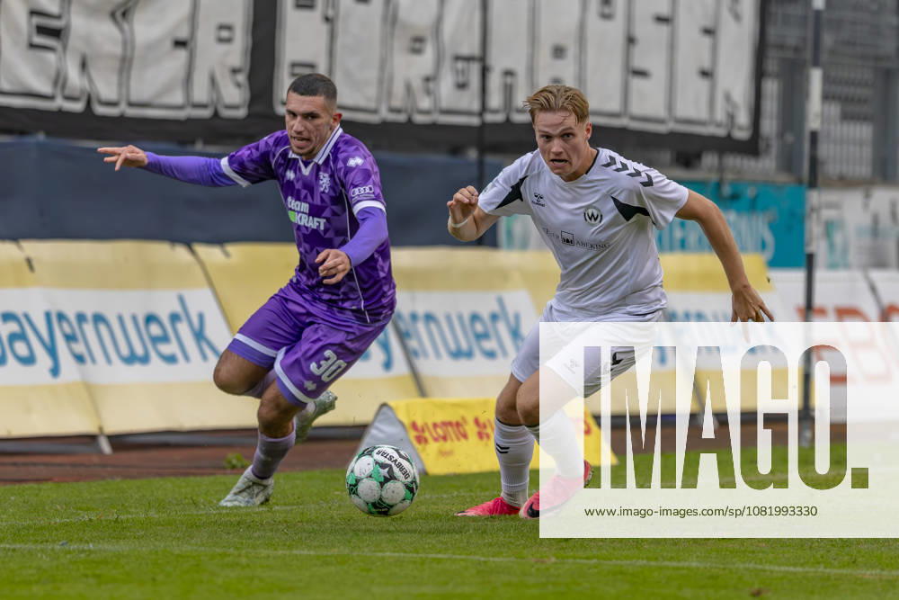 Burghausen, Germany, August 25, 2026, Toto Cup, 2026–2027 Bavarian State Cup, Round of 16: SV Wacker Burghausen vs. FC Ingolstadt 04. Pictured, from left, in a tackle: Ognjen Drakulic (FCI) and Benedikt Schwarzensteiner (Burghausen)at Flatbuy Stadium, Bavaria