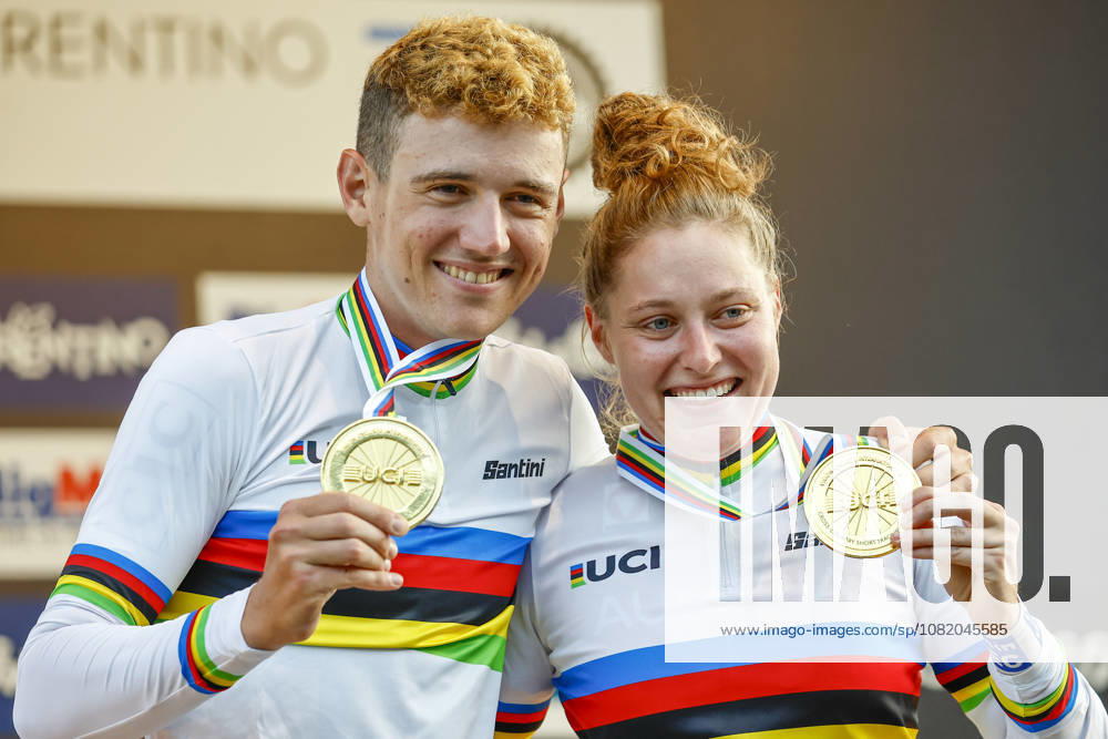 TRENTO, ITALY, AUGUST 27—Adrien Yves Claude Boichis of France and Laura Stigger of Austria are the new world champions and are celebrating their gold medals after the medal ceremony during the UCI Mountain Bike World Championships—Men’s Elite Cross-Country Short Track—in Val di Sole on August 27, 2026 in Trento, Italy