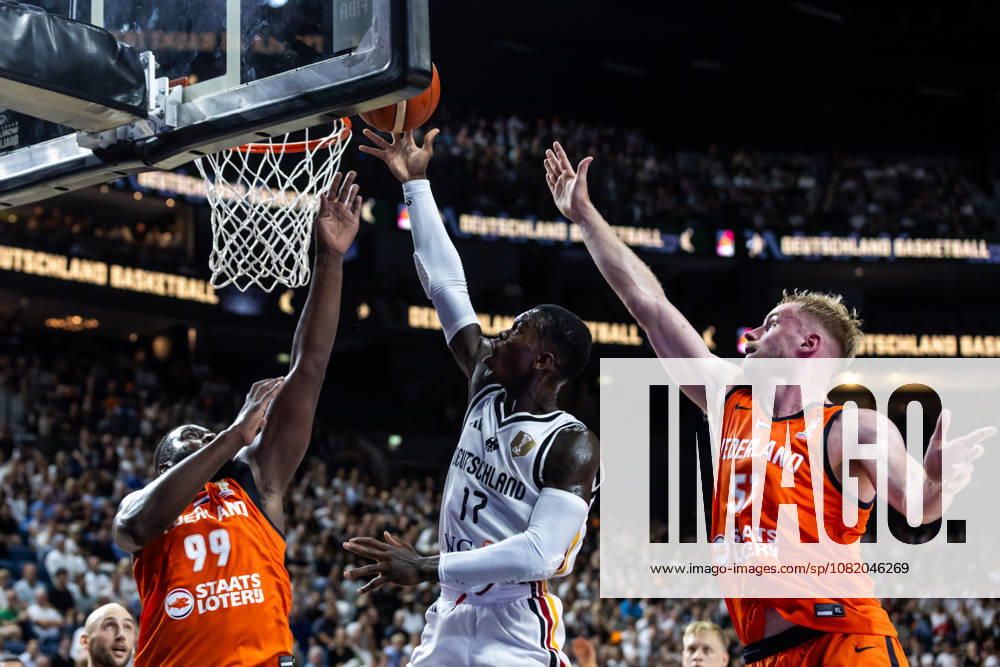 GER, FIBA 2027 Basketball World Cup, European Qualifiers, Cologne, Germany vs. Turkey; Dennis Schröder (Germany), No. 17, in a one-on-one matchup against Rienk Mast (Netherlands), No. 51; Cologne, LANXESS Arena, North Rhine-Westphalia, Germany
